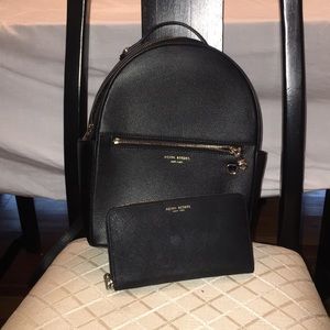 Henri Bendel backpack and matching wallet.